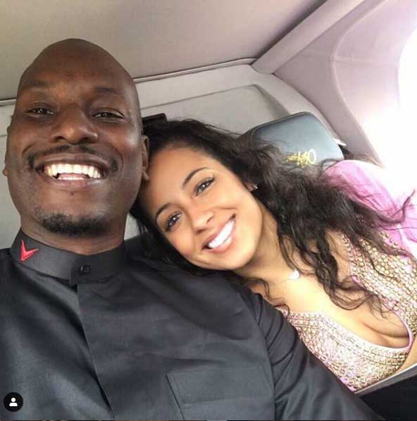 Samantha Lee Gibson and Tyrese Gibson taking picture together.